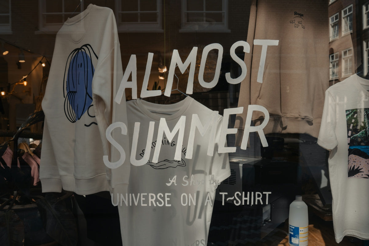 Shop window displays almost summer t-shirts