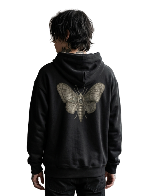 A person shown from the back wearing a black hoodie with a large detailed moth graphic printed on the back