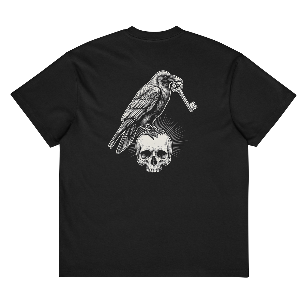 Back of a black heavyweight box tee with a bone raven, key, and skull print