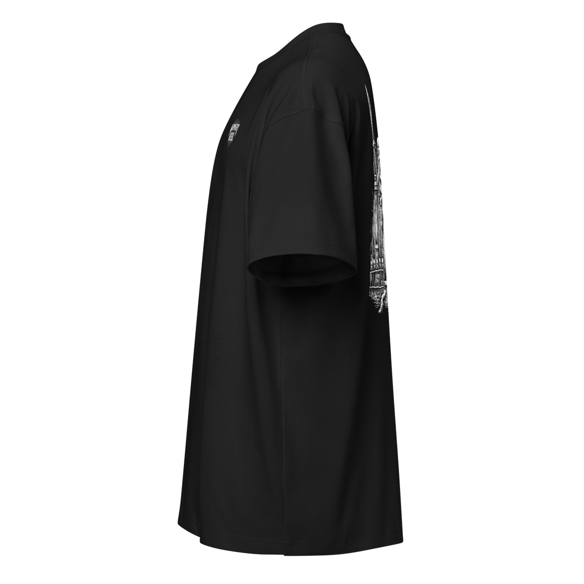 Left side of a black heavyweight box tee showing the back print edge and chest mark