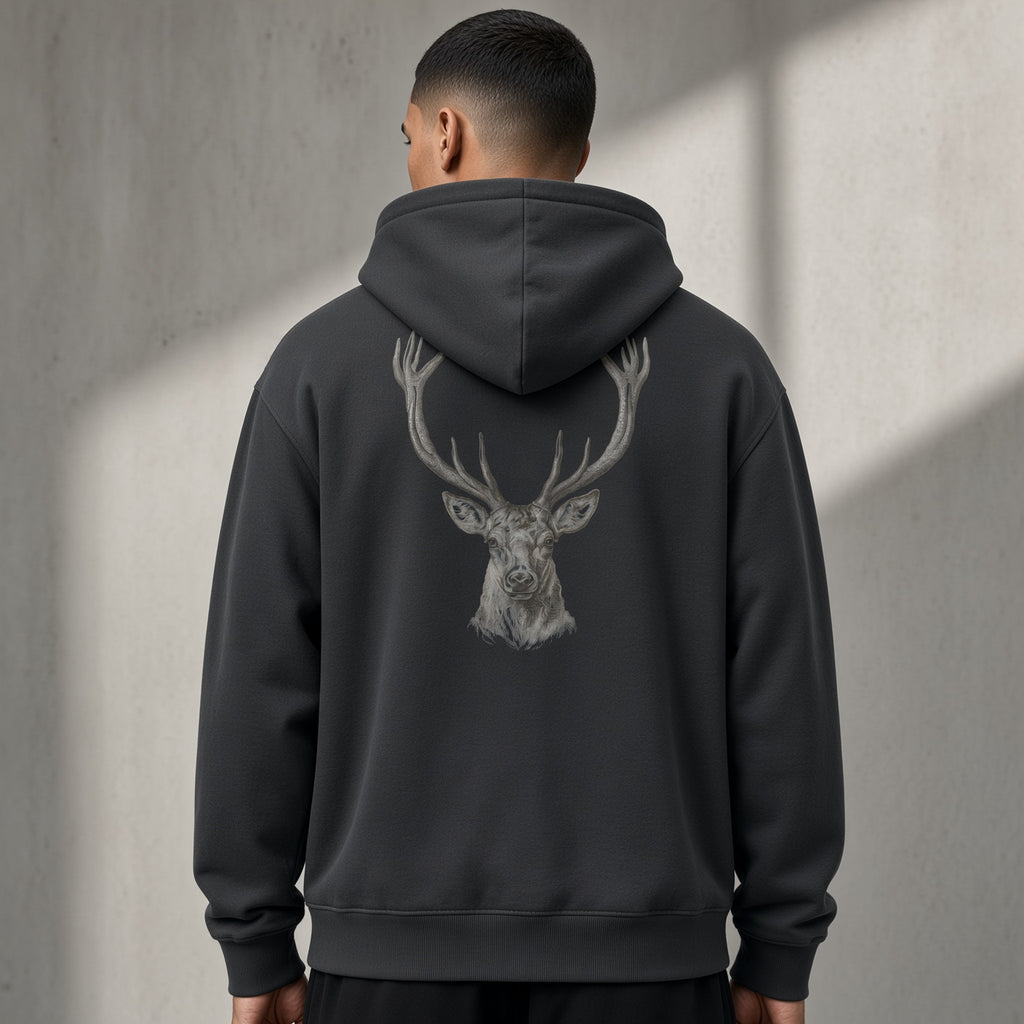 Back of a black heavyweight hoodie with a grey stag head print, worn oversized