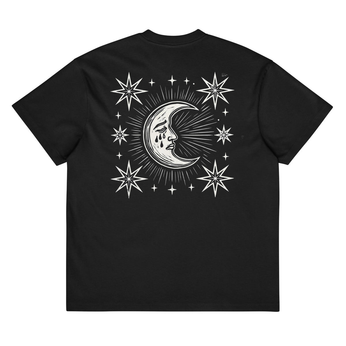 Back of a black heavyweight box tee with a bone crescent moon and stars print