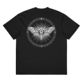 A black short-sleeve crewneck t-shirt featuring a large white graphic print on the back. The graphic depicts a detailed moth inside a circular frame with radiating lines and occult-style symbols.