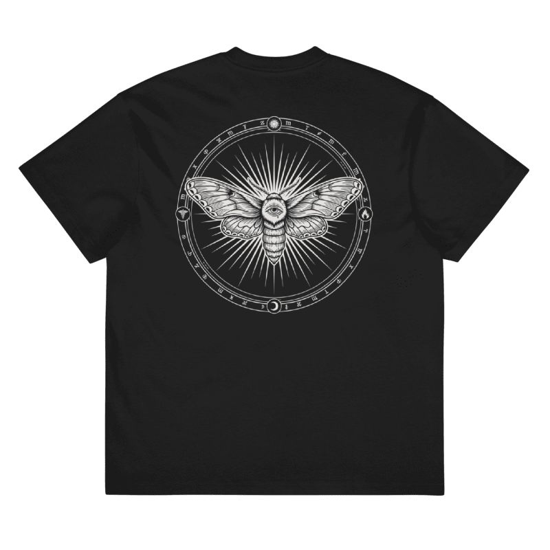 A black short-sleeve crewneck t-shirt featuring a large white graphic print on the back. The graphic depicts a detailed moth inside a circular frame with radiating lines and occult-style symbols.