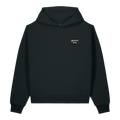 The Outer Shroud Sculpted Hoodie in Obsidian Black by Midnight Veil Designs. An ultra-heavyweight 500 GSM 15 oz premium organic cotton cordless hoodie featuring a high-density bone-white screen-printed signature house shield logo on the front left chest over a rigid oversized boxy drop-shoulder silhouette.